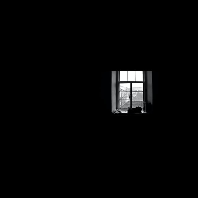 Dark room with light shining through window