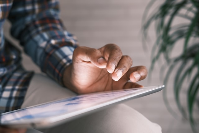 man working on tablet to create value for customers