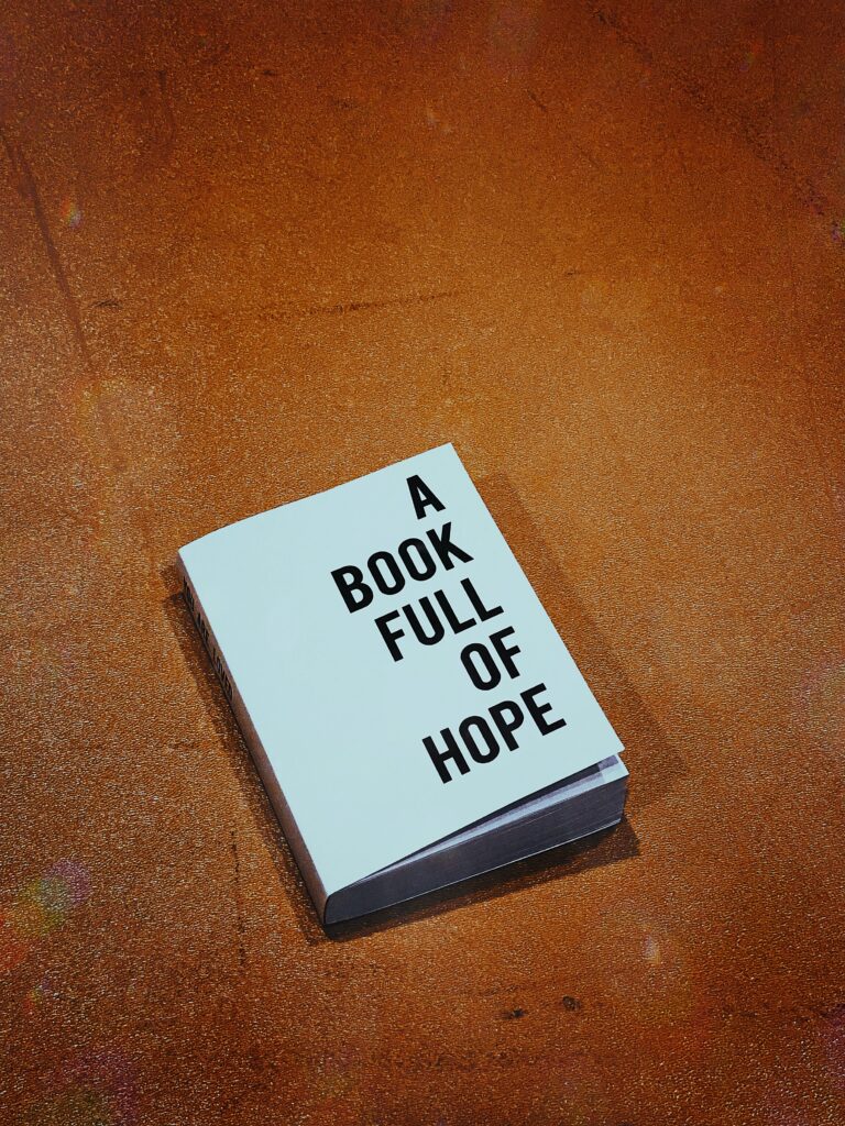 A white book titled "A Book Full of Hope". For self published book marketing.